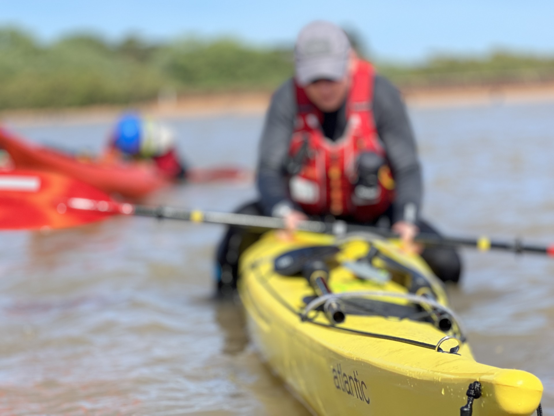 Balancing on the back deck of a sea kayak on the .Sea Kayak Safety & Recovery Masterclass