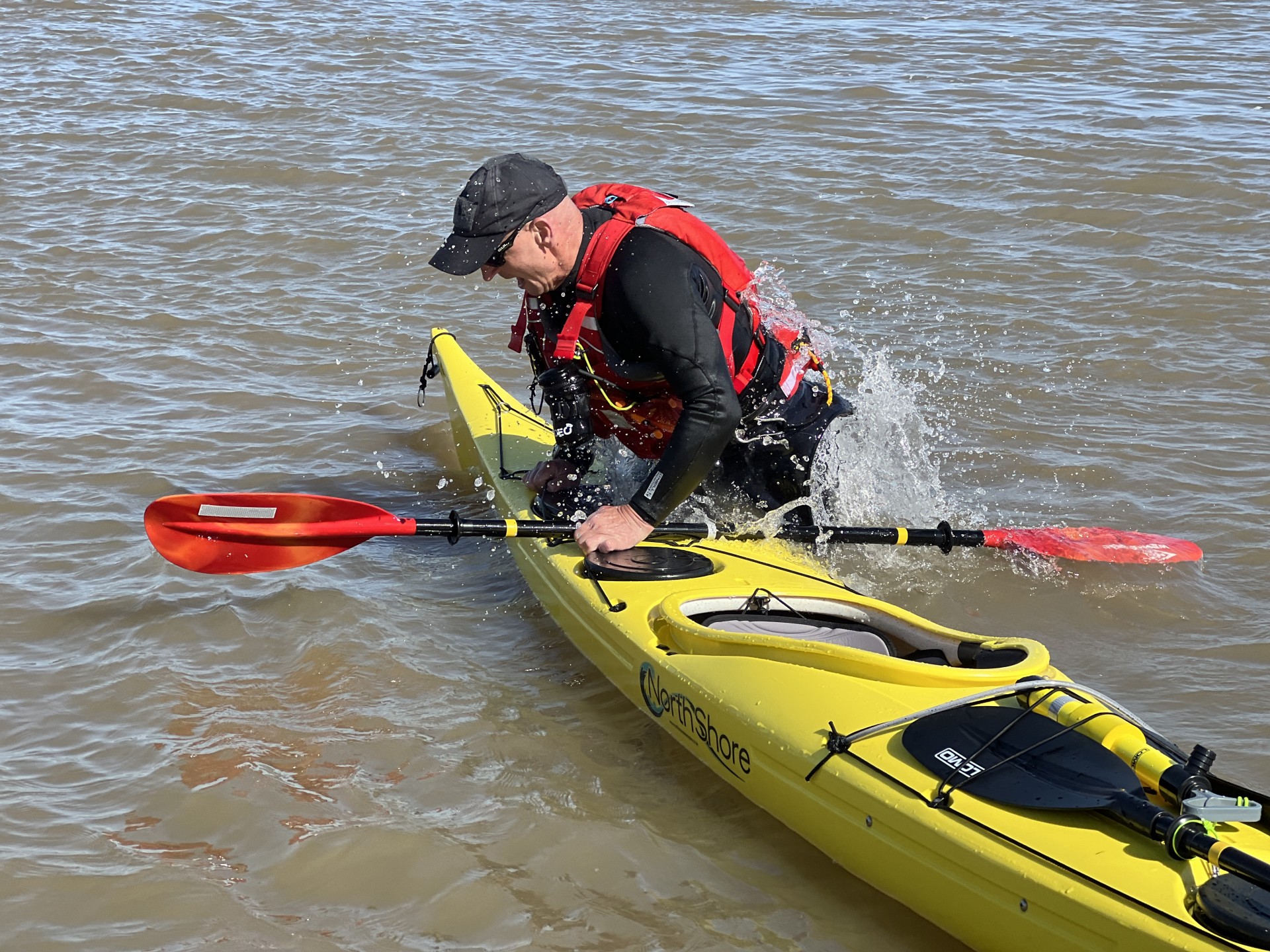 Back deck self-recovery practice in the shallows with NOMAD Sea Kayaking.