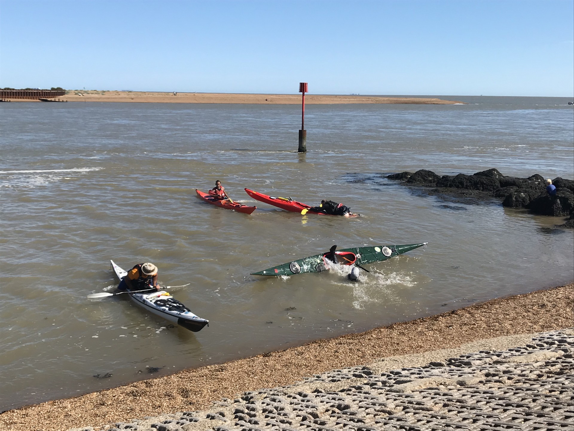 Practising self-recoveries in the shallows off the Deben estuary with NOMAD Sea Kayaking.